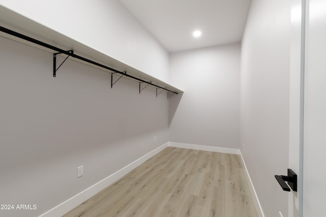 spacious closet featuring light wood-type flooring