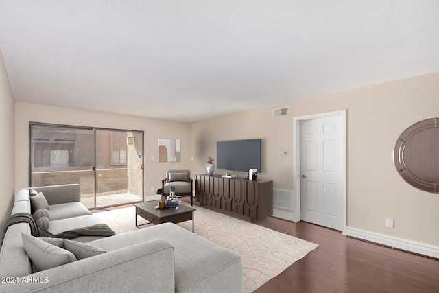 living room with dark hardwood / wood-style floors