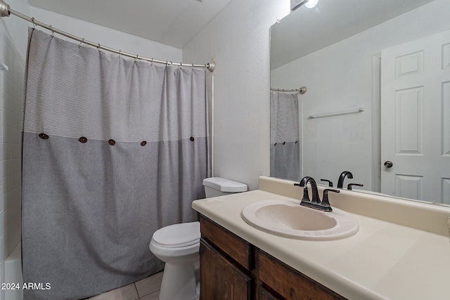 bathroom with vanity, toilet, and tile patterned flooring