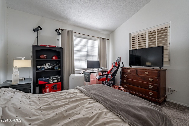 carpeted bedroom featuring lofted ceiling and a textured ceiling