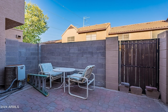 view of patio with central AC