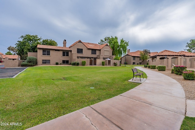 exterior space featuring a front lawn