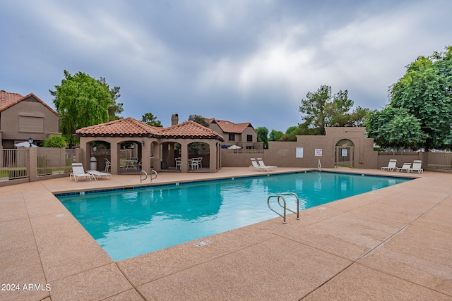 view of swimming pool featuring a patio