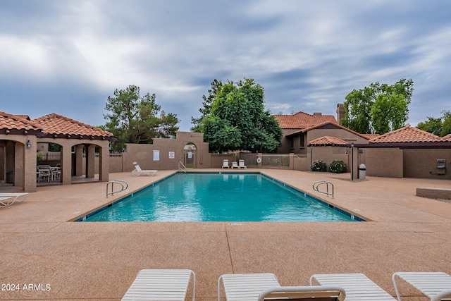 view of swimming pool featuring a patio area