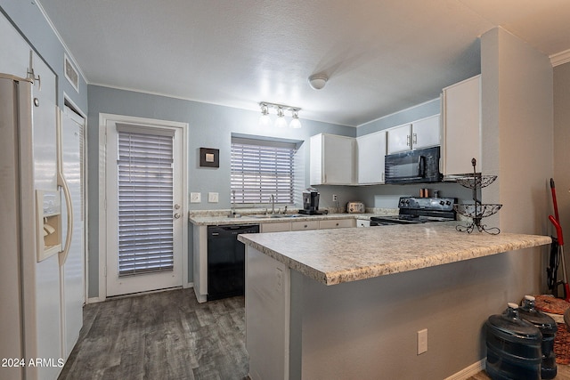 kitchen featuring kitchen peninsula, sink, black appliances, white cabinets, and dark hardwood / wood-style flooring