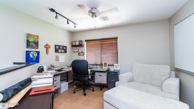 office area with light tile patterned floors, track lighting, and ceiling fan