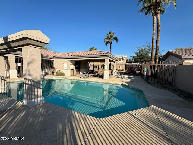 view of swimming pool with a patio area