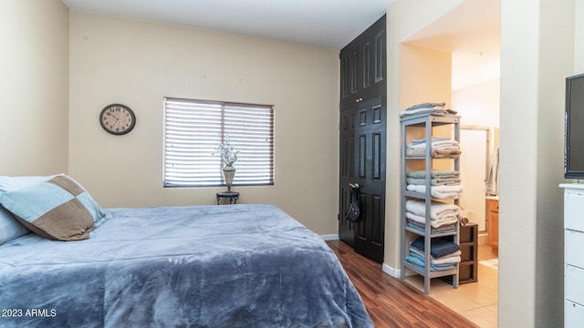 bedroom with hardwood / wood-style floors