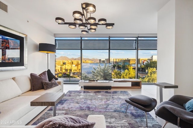 living room featuring floor to ceiling windows and a notable chandelier