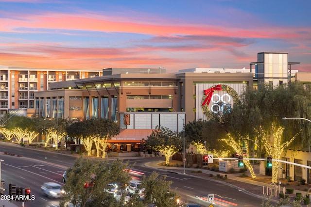 view of outdoor building at dusk