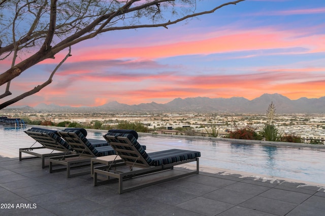 patio terrace at dusk with a mountain view