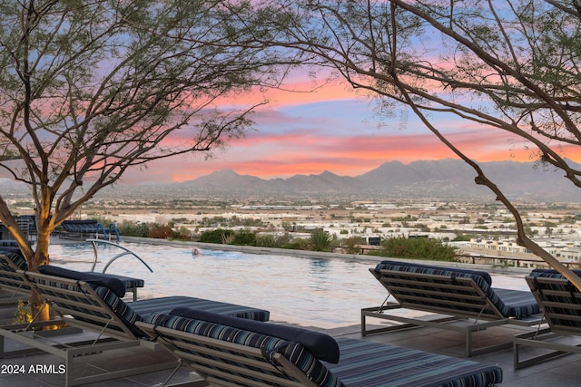 patio terrace at dusk with a mountain view