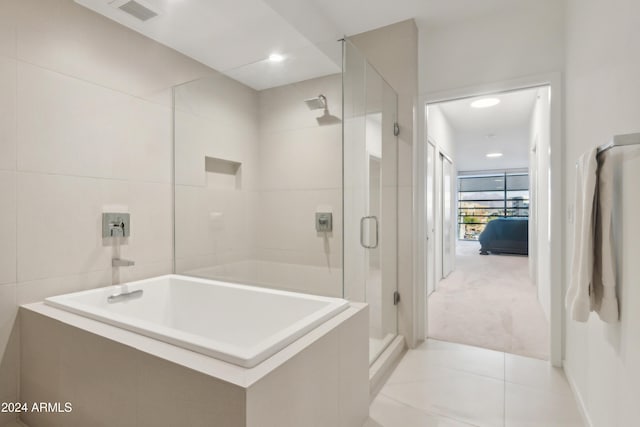 bathroom with tile walls and walk in shower