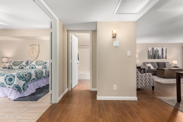 corridor featuring hardwood / wood-style floors