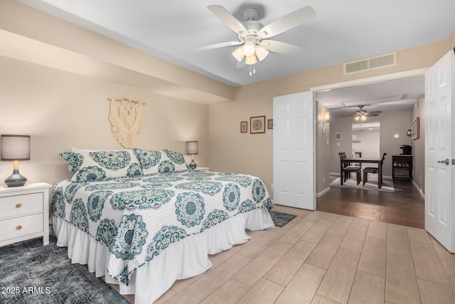 bedroom with hardwood / wood-style flooring and ceiling fan