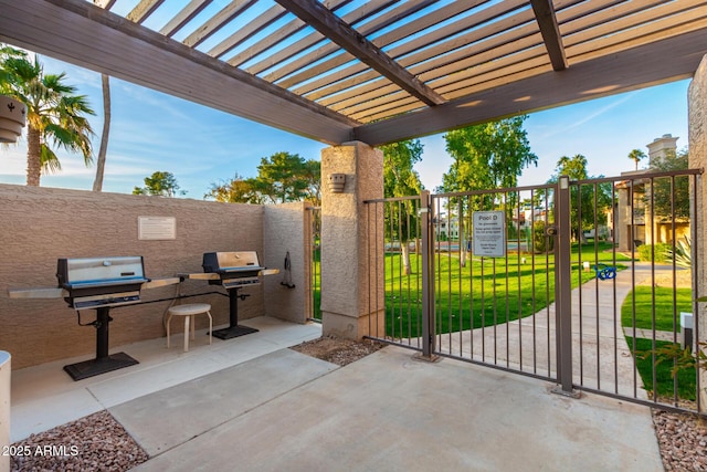 view of patio / terrace featuring grilling area and a pergola