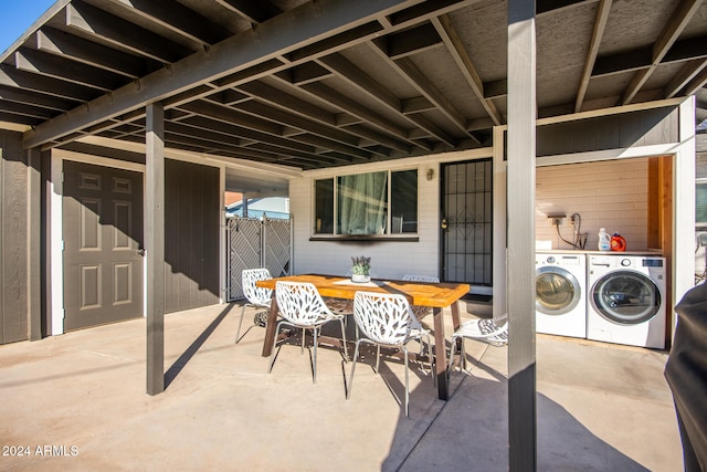 view of patio / terrace with washing machine and clothes dryer