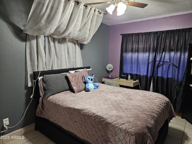 4507 E Saint Catherine Ave, Phoenix, AZ 85042 - bedroom with tile patterned flooring and a ceiling fan