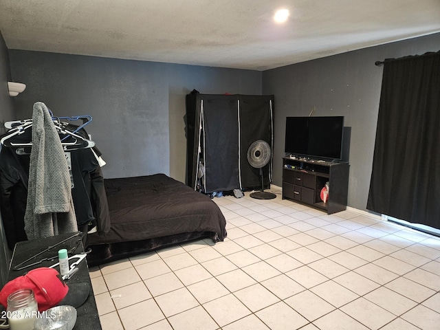 4507 E Saint Catherine Ave, Phoenix, AZ 85042 - bedroom featuring light tile patterned flooring