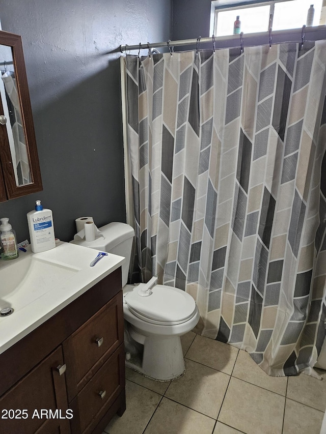 4507 E Saint Catherine Ave, Phoenix, AZ 85042 - bathroom featuring tile patterned flooring, toilet, vanity, and a shower with shower curtain