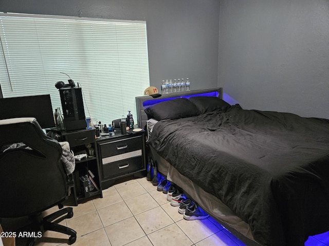 4507 E Saint Catherine Ave, Phoenix, AZ 85042 - bedroom with light tile patterned floors and a desk