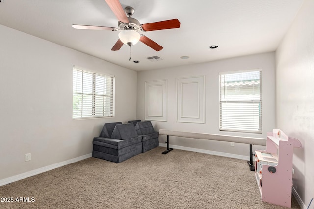 20709 W Delaney Dr, Buckeye, AZ 85396 - living area with carpet flooring and ceiling fan
