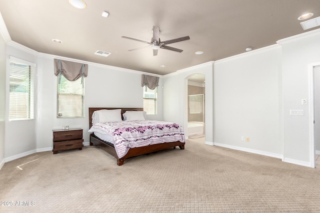 20709 W Delaney Dr, Buckeye, AZ 85396 - bedroom featuring crown molding, carpet floors, arched walkways, recessed lighting, and ensuite bath