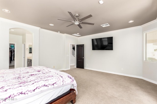20709 W Delaney Dr, Buckeye, AZ 85396 - bedroom featuring recessed lighting, light colored carpet, crown molding, arched walkways, and a walk in closet