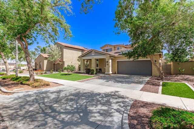 20709 W Delaney Dr, Buckeye, AZ 85396 - view of front of house featuring stucco siding, driveway, solar panels, a tiled roof, and an attached garage