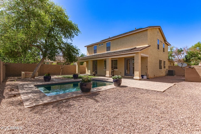 20709 W Delaney Dr, Buckeye, AZ 85396 - back of property with stucco siding, a fenced backyard, and a patio area