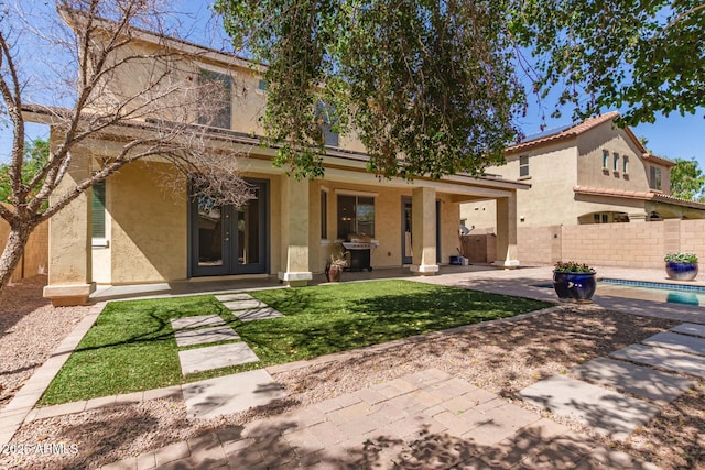 20709 W Delaney Dr, Buckeye, AZ 85396 - back of property with stucco siding and a patio area