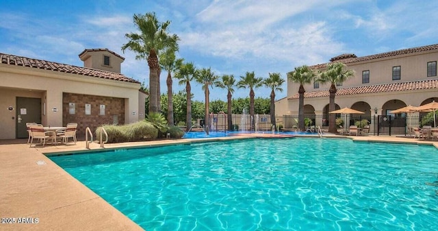 20709 W Delaney Dr, Buckeye, AZ 85396 - community pool with a patio