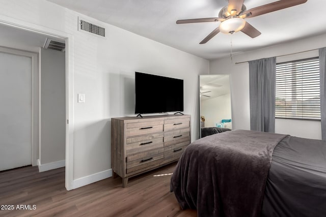 bedroom featuring ceiling fan and dark hardwood / wood-style flooring