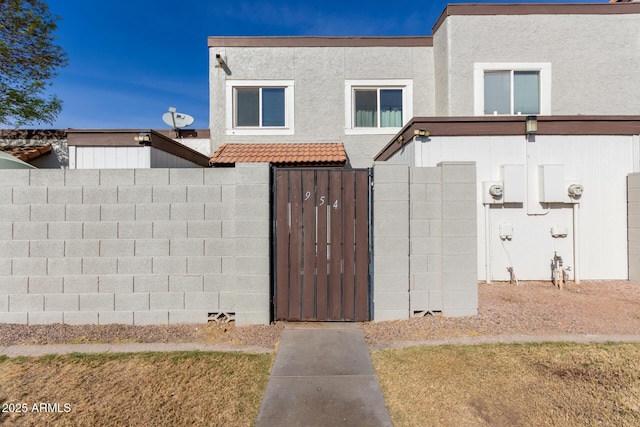 view of gate featuring a fenced front yard