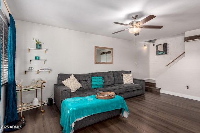 living room featuring ceiling fan, dark wood-style flooring, and baseboards