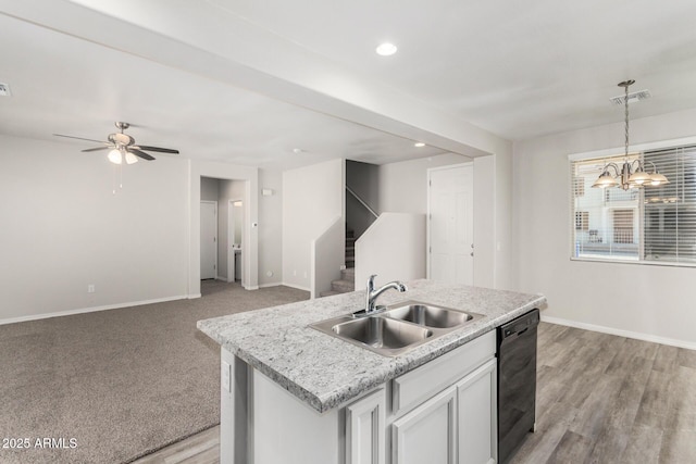 810 E Agua Fria Ln, Avondale, AZ 85323 - kitchen featuring dishwasher, baseboards, a sink, decorative light fixtures, and open floor plan