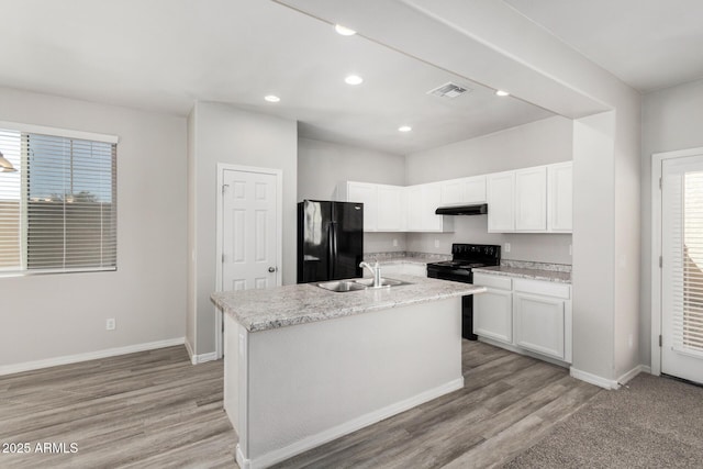 810 E Agua Fria Ln, Avondale, AZ 85323 - kitchen with white cabinetry, baseboards, a sink, visible vents, and black appliances