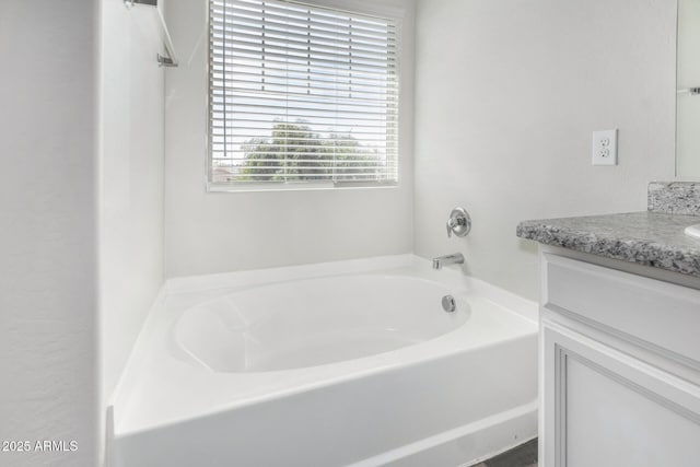 810 E Agua Fria Ln, Avondale, AZ 85323 - bathroom with vanity and a garden tub