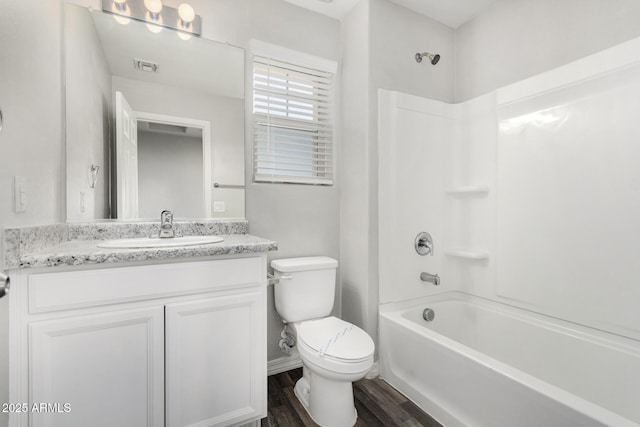 810 E Agua Fria Ln, Avondale, AZ 85323 - bathroom with visible vents, wood finished floors, toilet, vanity, and shower / bathing tub combination