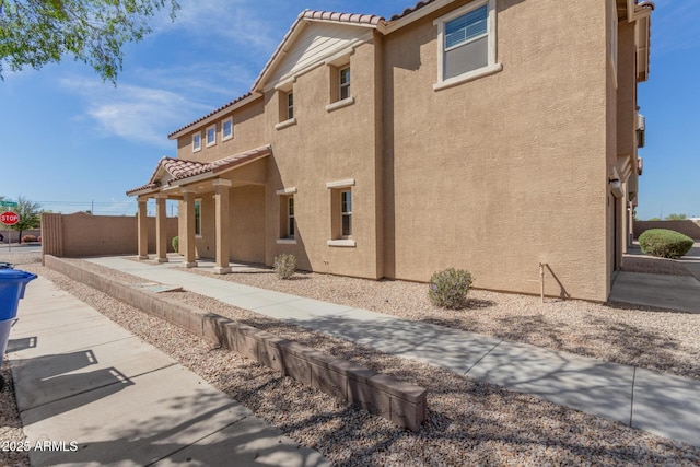 810 E Agua Fria Ln, Avondale, AZ 85323 - back of property with a tile roof and stucco siding