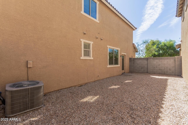 810 E Agua Fria Ln, Avondale, AZ 85323 - exterior space featuring stucco siding, central air condition unit, and a fenced backyard