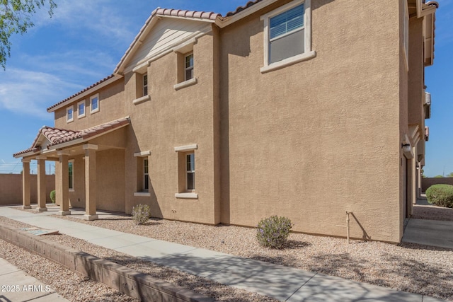 810 E Agua Fria Ln, Avondale, AZ 85323 - rear view of house with a tile roof and stucco siding