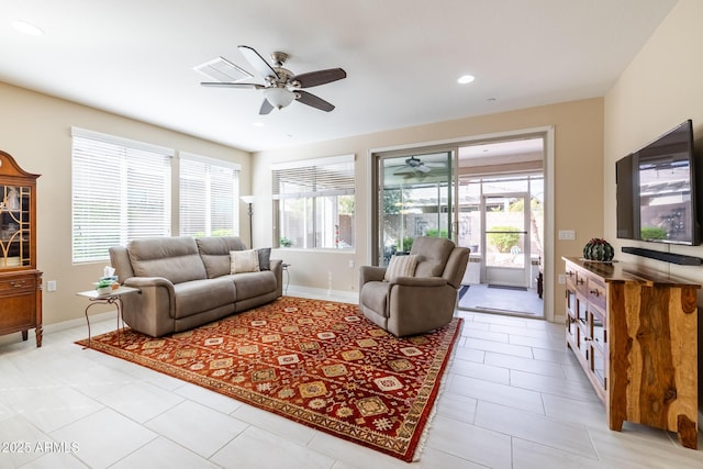 tiled living room with ceiling fan