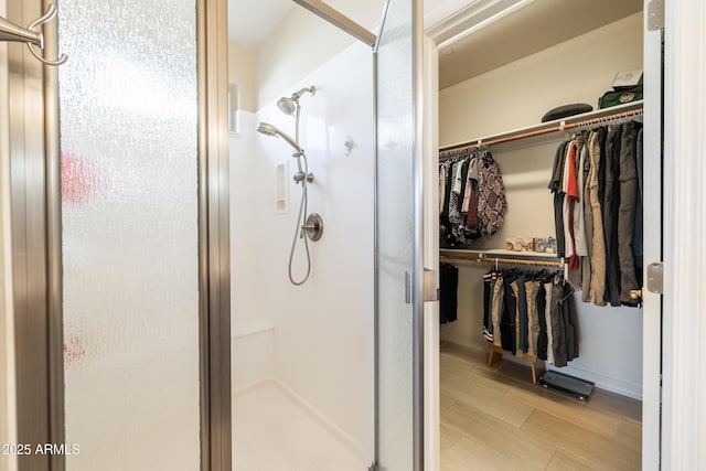 bathroom featuring an enclosed shower