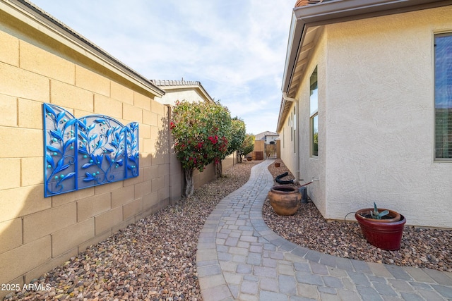 view of side of home featuring a patio area