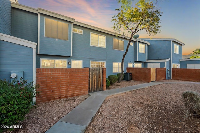 2301 E University Dr Unit 339, Mesa, AZ 85213 - view of front facade with cooling unit and a gate