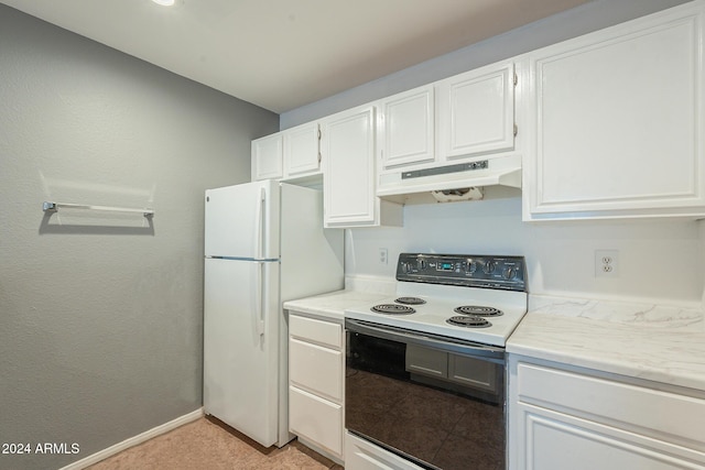 2301 E University Dr Unit 339, Mesa, AZ 85213 - kitchen with electric stove, under cabinet range hood, freestanding refrigerator, white cabinets, and light countertops