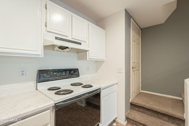 2301 E University Dr Unit 339, Mesa, AZ 85213 - kitchen with electric range, under cabinet range hood, white cabinetry, and light stone countertops