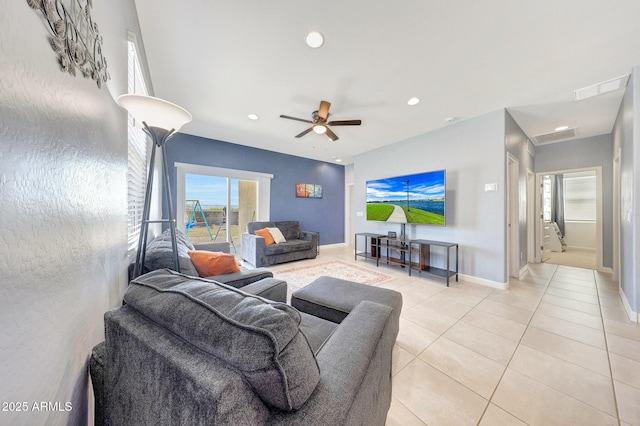 living area featuring visible vents, baseboards, recessed lighting, a ceiling fan, and light tile patterned floors