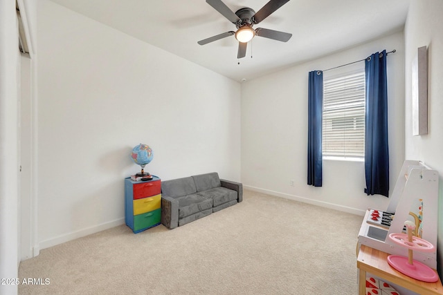 game room with carpet floors, baseboards, and ceiling fan